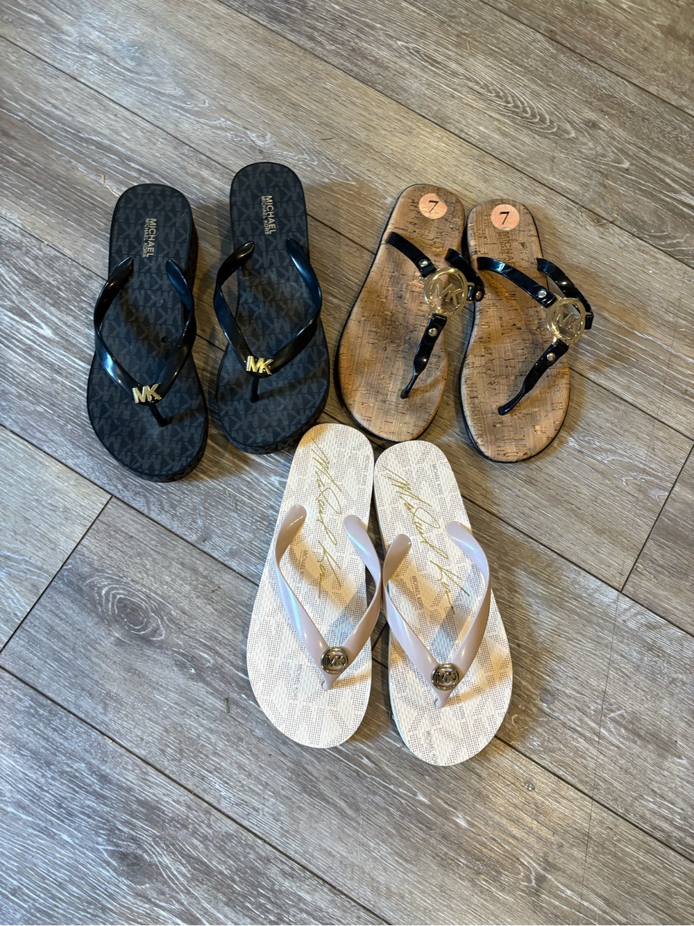 Bundle of Michael Kors Women's Logo Flip Flop Sandals - Black, Beige, and Tan